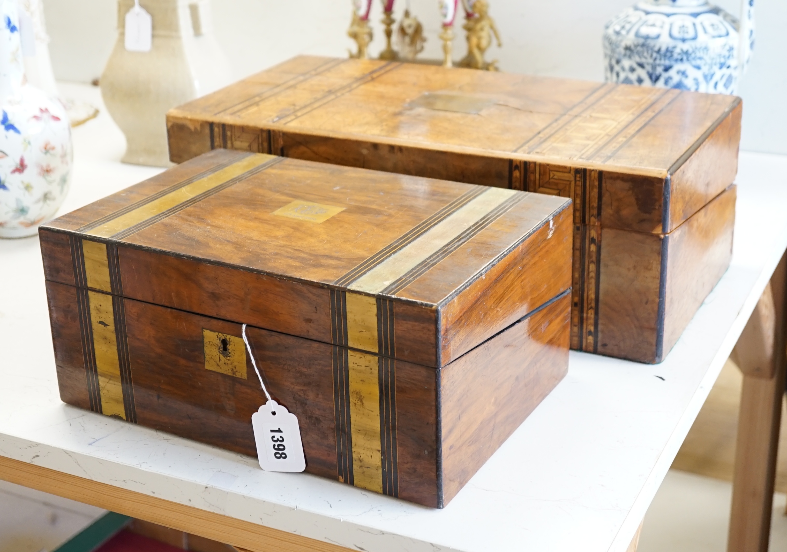 Two Victorian inlaid walnut writing slopes, largest 50cm wide. Condition - poor to fair